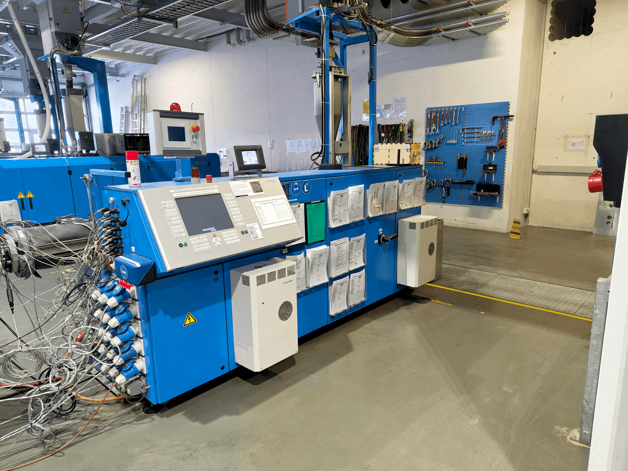 Front view of Krauss Maffei KME 75-36 R AC machine