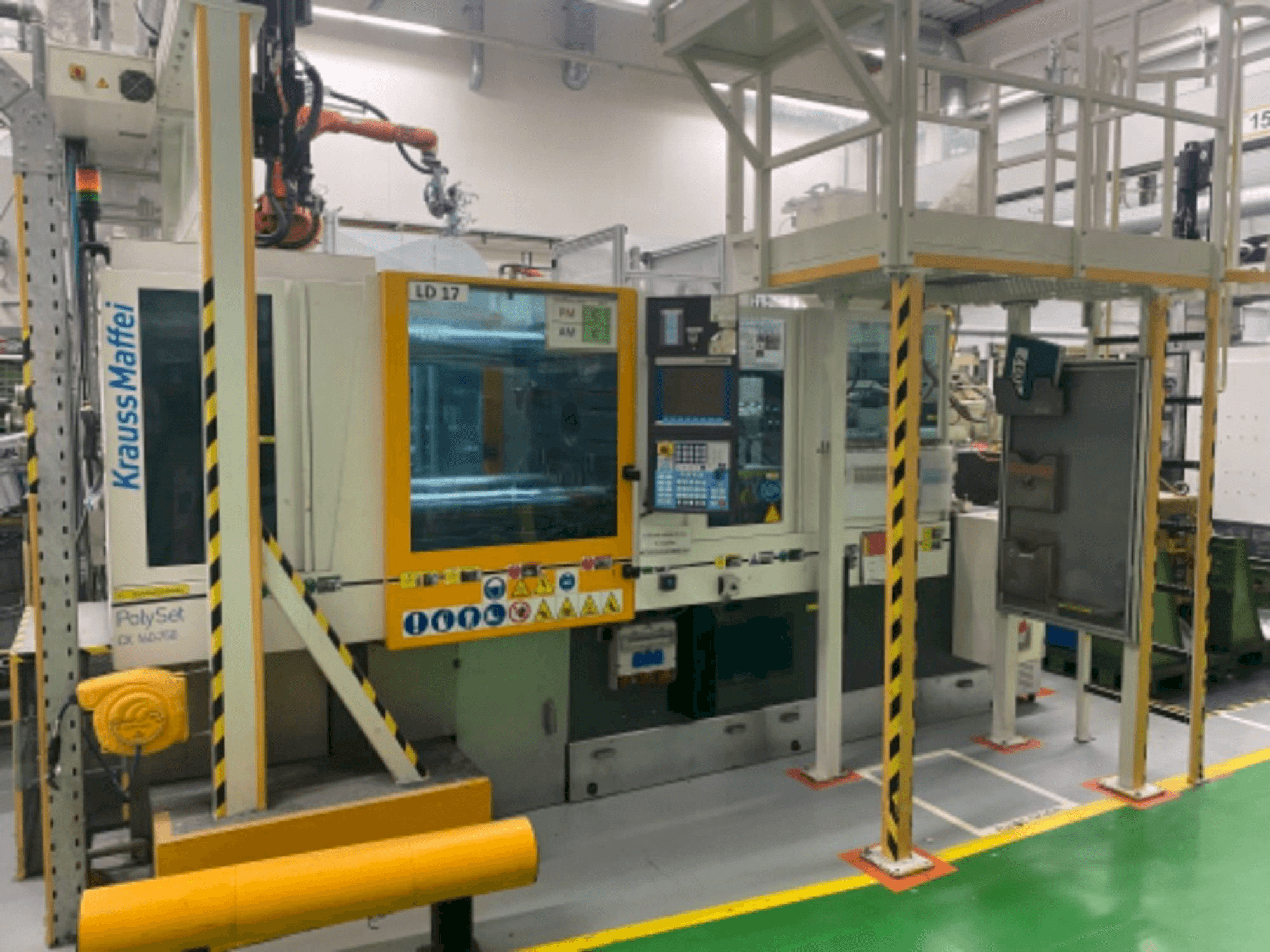 Front view of Krauss Maffei 160/750 CX POL machine