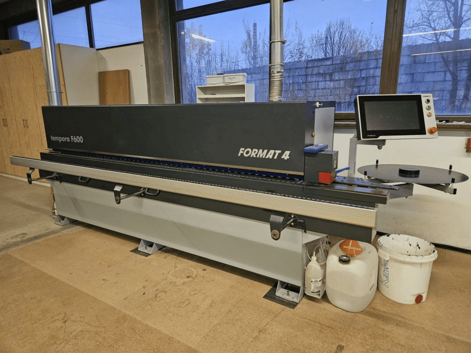 Templora F600 by Format 4, front view of a woodworking machine with digital display, cutting table, and storage containers.