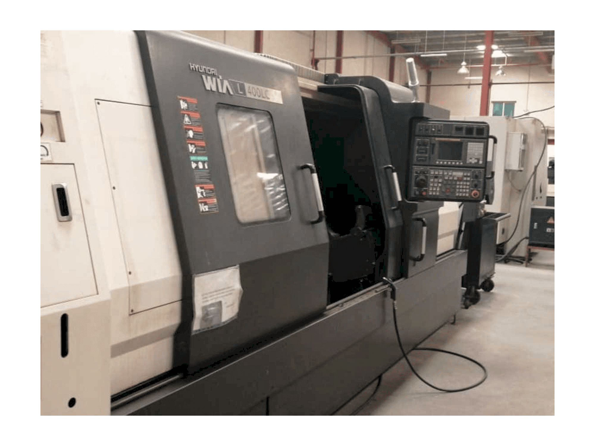 Left side view of Hyundai Wia L400LC machine