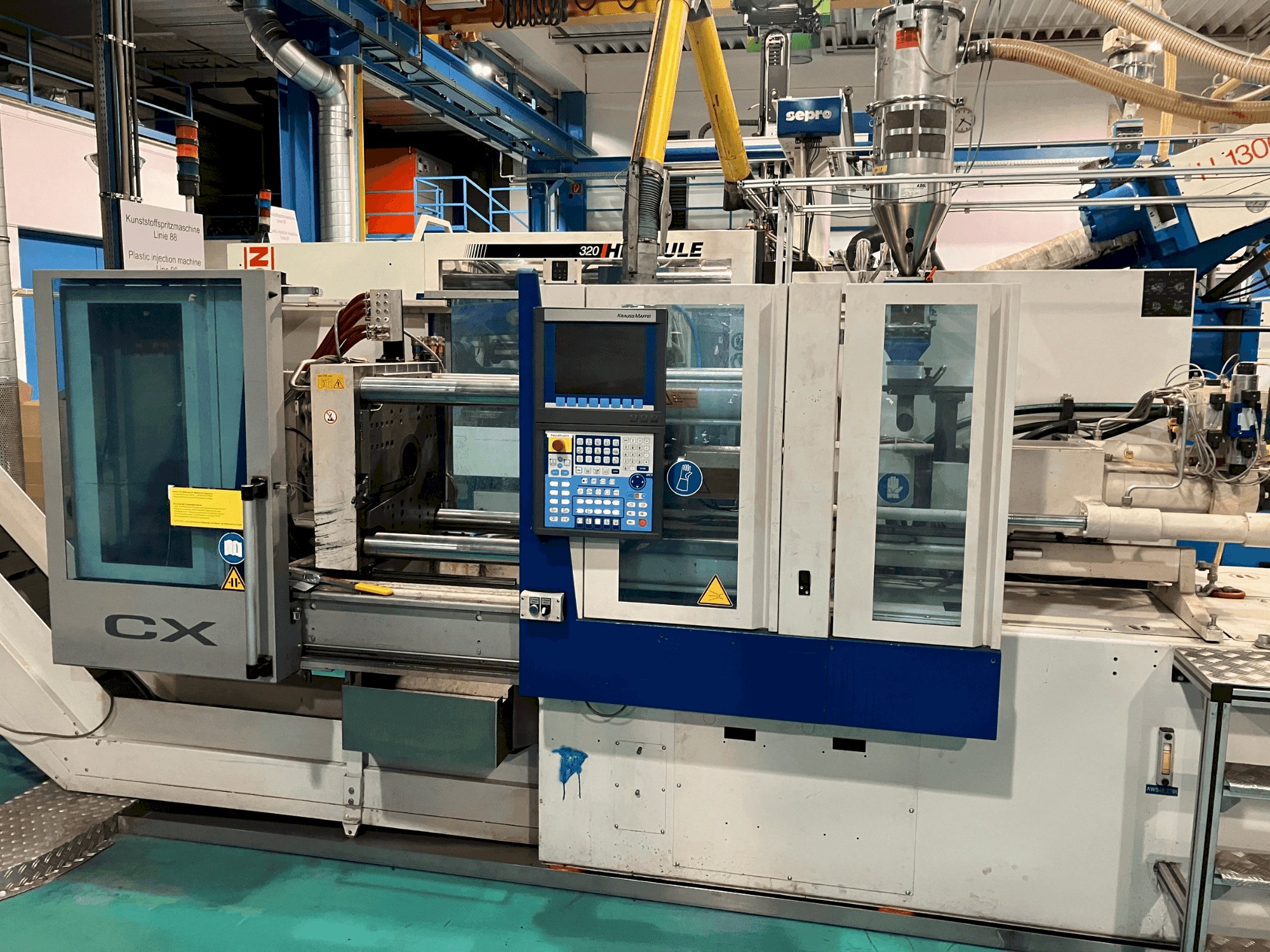 Frontansicht der Krauss Maffei 65-180 CX Maschine