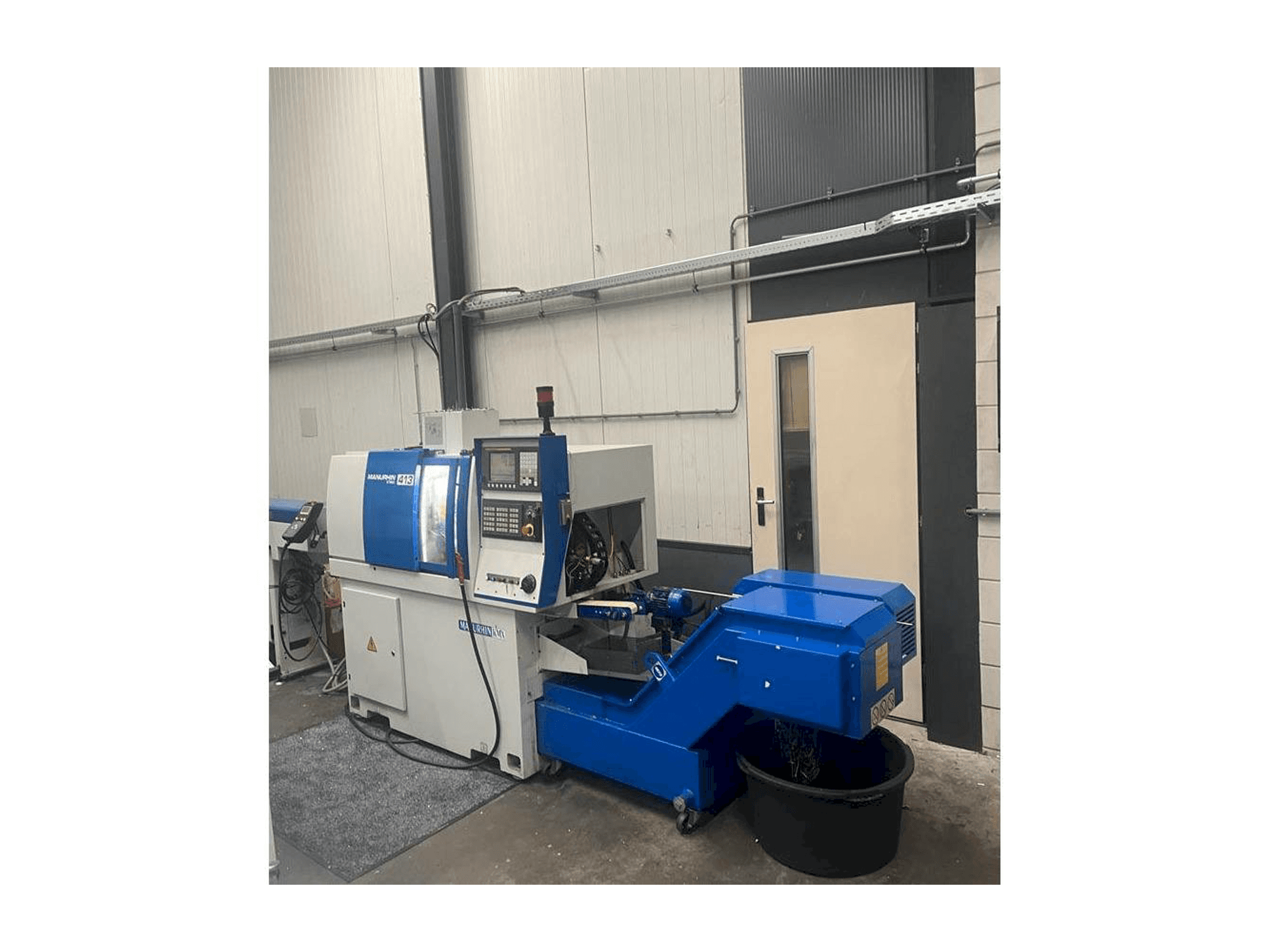 Frontansicht der Manurhin K'MX 413 Maschine