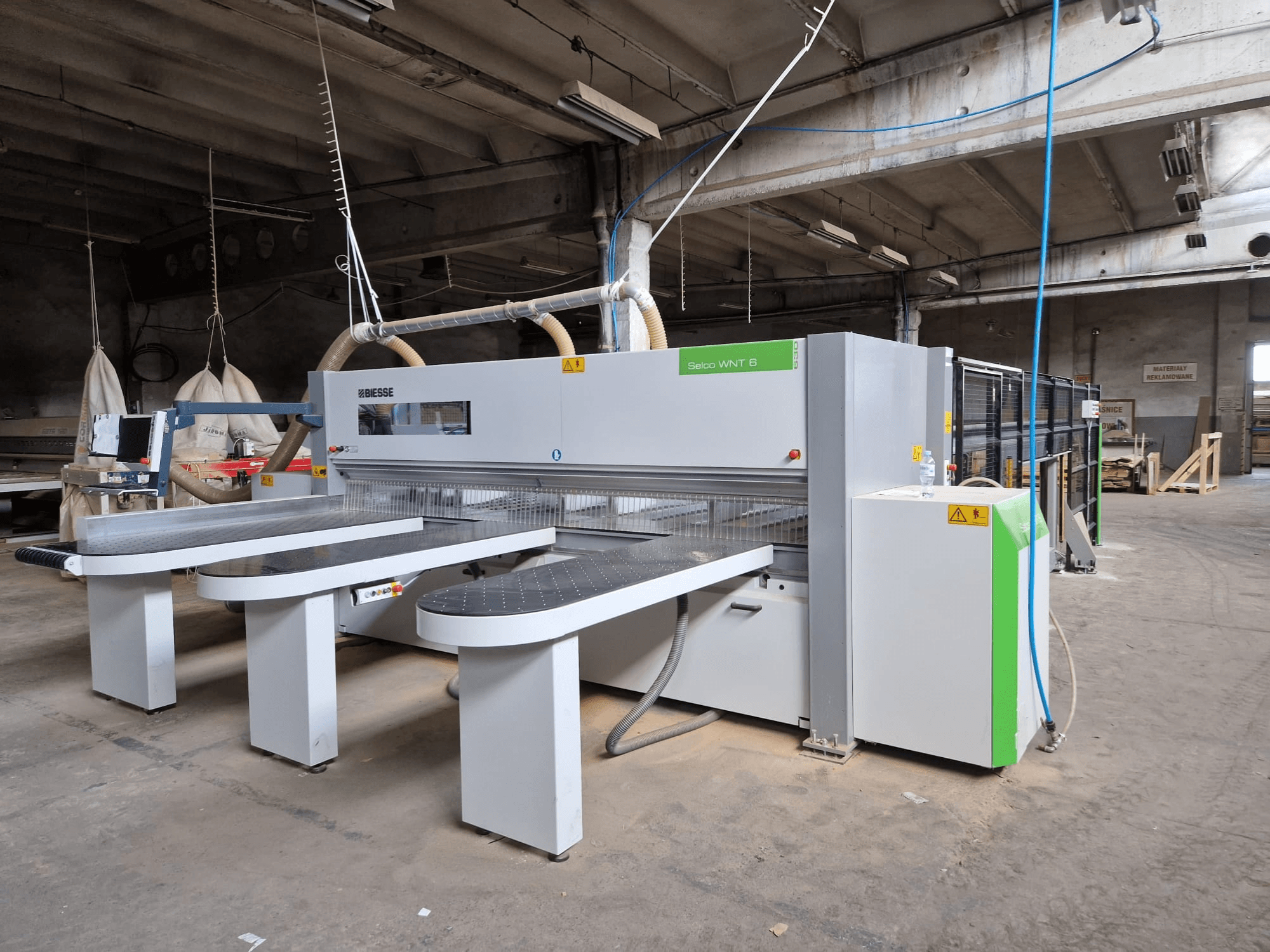 Biesse Selco WNT 6 panel saw in a factory setting, front view displaying connected blades and control panel.